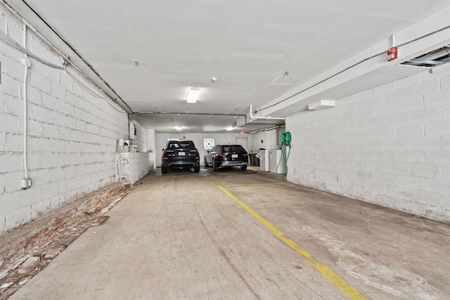 parking deck featuring concrete block wall