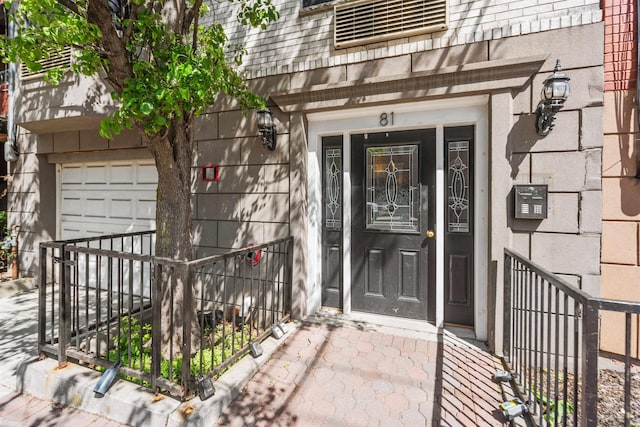 entrance to property featuring a garage