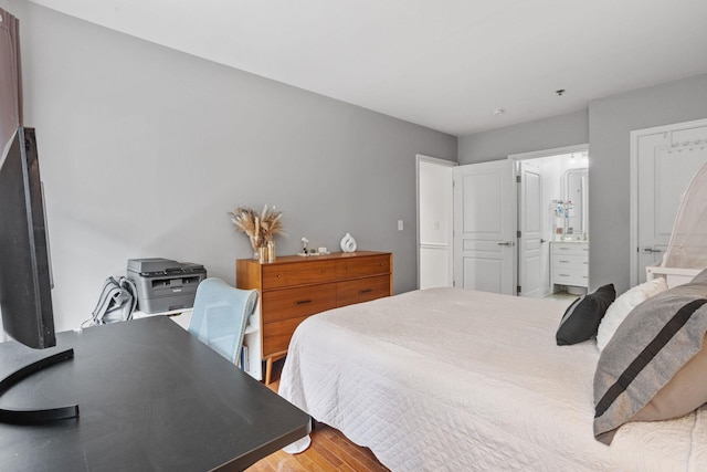 501 9th St Unit 407, Hoboken, NJ 07030 - bedroom with wood finished floors and ensuite bath
