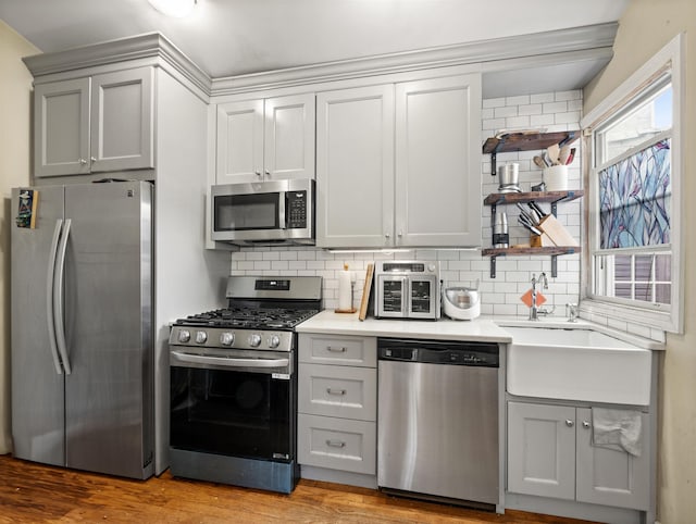 211 Plainfield Ave, Jersey City, NJ 07306 - kitchen featuring appliances with stainless steel finishes, open shelves, gray cabinetry, and backsplash