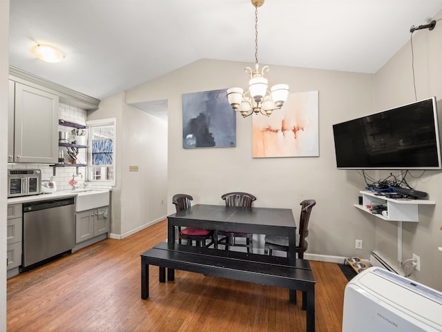 211 Plainfield Ave, Jersey City, NJ 07306 - dining space with a chandelier, light wood-style flooring, and lofted ceiling