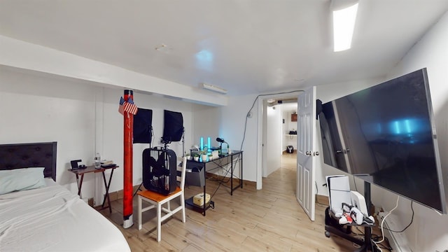 bedroom with wood finished floors