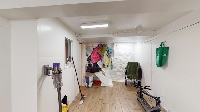 exercise area with light wood finished floors