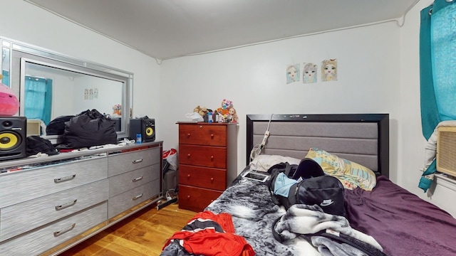 bedroom with wood finished floors