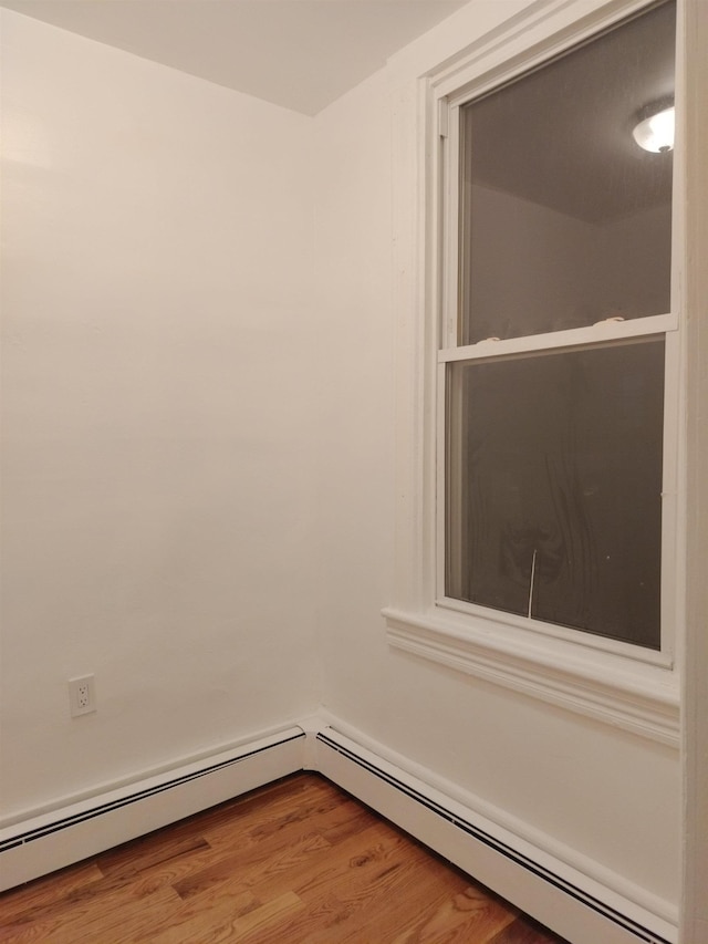 empty room with wood finished floors