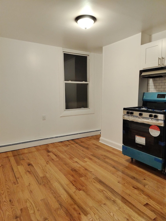 kitchen featuring stainless steel range with electric stovetop, light wood-type flooring, under cabinet range hood, backsplash, and a baseboard heating unit