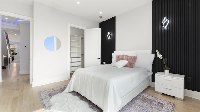 93 Terrace Ave Unit 2, Jersey City, NJ 07037 - bedroom featuring light wood-type flooring, recessed lighting, and a walk in closet