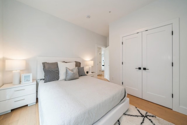 bedroom with a closet and light wood-style floors