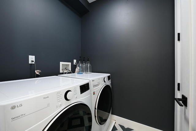 77 Clerk St Unit 1, Jersey City, NJ 07305 - clothes washing area with baseboards, washer and dryer, and laundry area