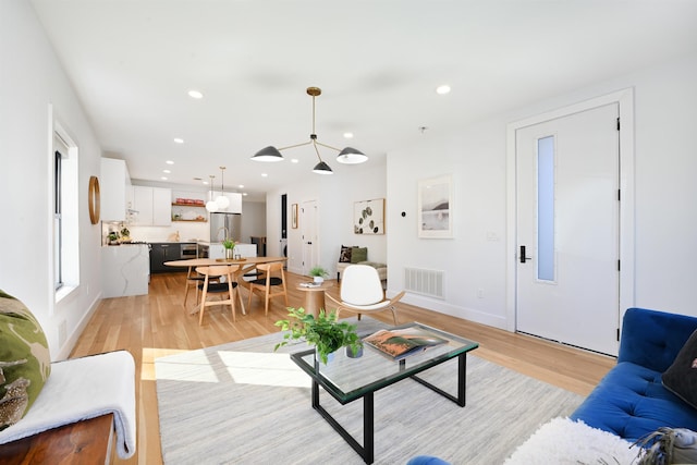 77 Clerk St Unit 1, Jersey City, NJ 07305 - living area with baseboards, light wood-style flooring, visible vents, and recessed lighting