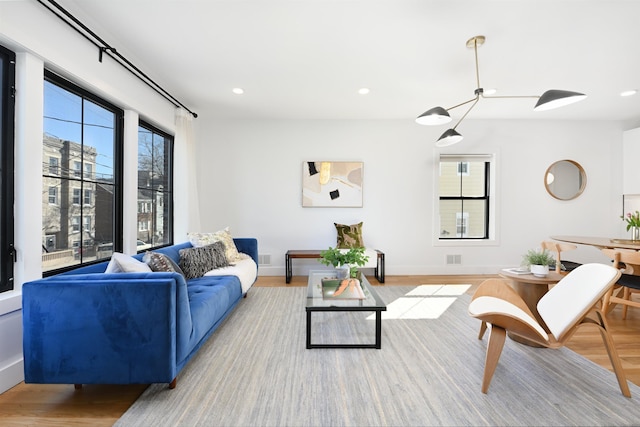 77 Clerk St Unit 1, Jersey City, NJ 07305 - living room featuring recessed lighting, wood finished floors, and baseboards