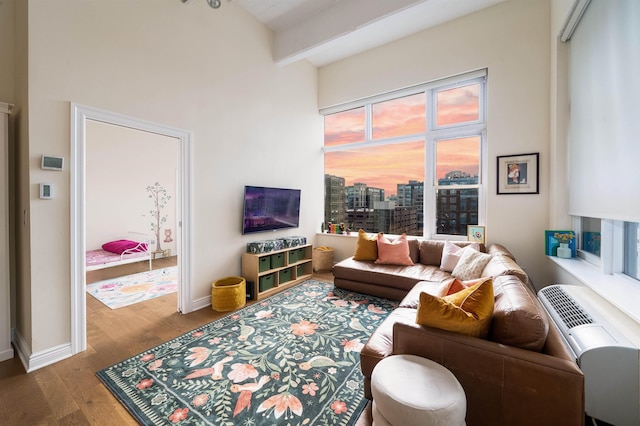 1500 Hudson St Unit 7R, Hoboken, NJ 07030 - living room featuring a towering ceiling, wood finished floors, beam ceiling, and a city view