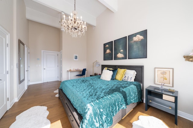 1500 Hudson St Unit 7R, Hoboken, NJ 07030 - bedroom with a chandelier, a high ceiling, wood finished floors, and beamed ceiling