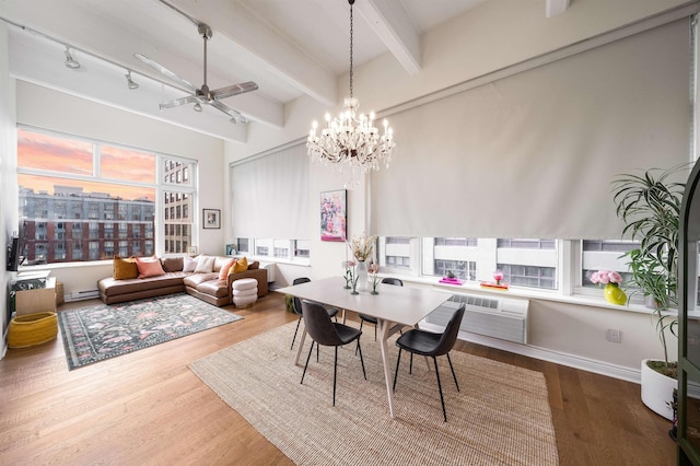 1500 Hudson St Unit 7R, Hoboken, NJ 07030 - dining room with beamed ceiling, wood finished floors, ceiling fan, a chandelier, and track lighting