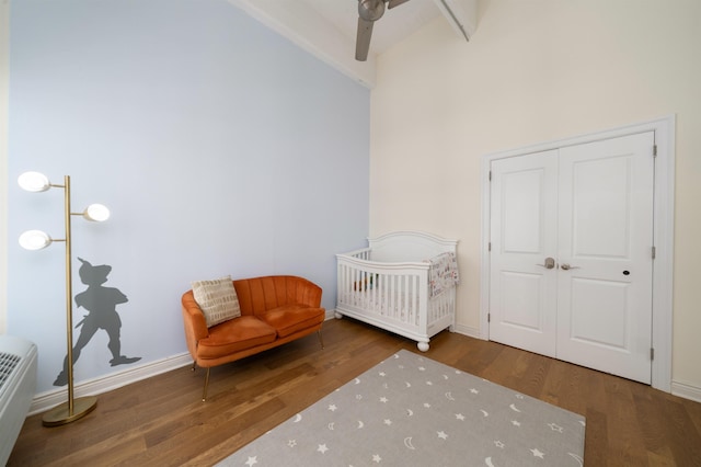 1500 Hudson St Unit 7R, Hoboken, NJ 07030 - bedroom with wood finished floors, a closet, high vaulted ceiling, beam ceiling, and a nursery area