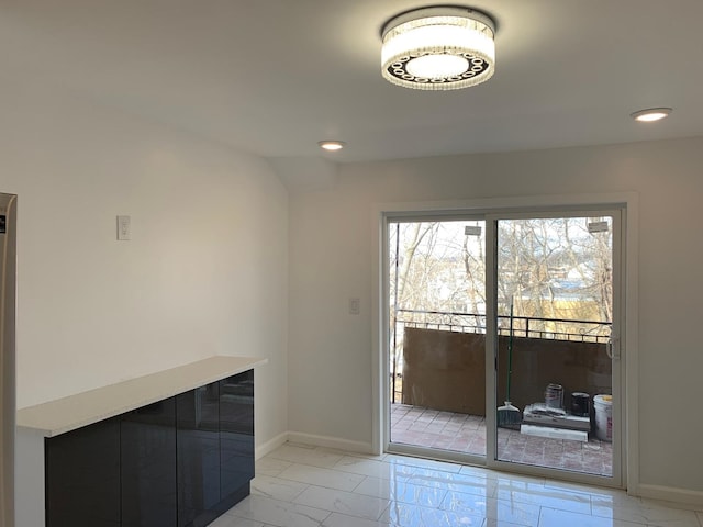 1604 74th St Unit 202, North Bergen, NJ 07047 - unfurnished dining area with light marble finish flooring, plenty of natural light, baseboards, and recessed lighting