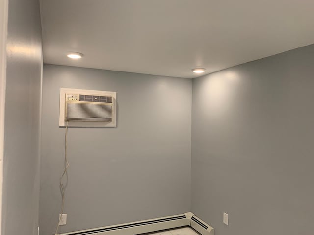 1604 74th St Unit 202, North Bergen, NJ 07047 - empty room featuring an AC wall unit and recessed lighting