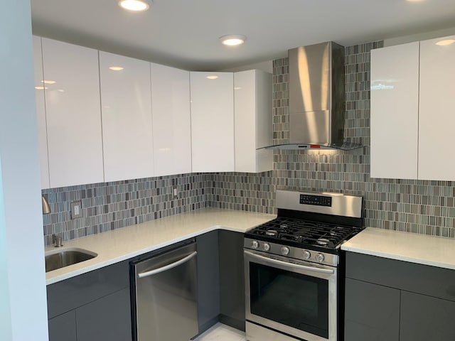 1604 74th St Unit 202, North Bergen, NJ 07047 - kitchen featuring stainless steel appliances, wall chimney exhaust hood, modern cabinets, gray cabinetry, and recessed lighting