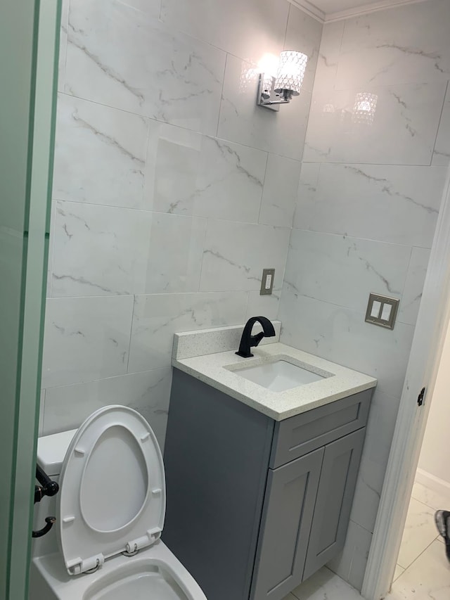 1604 74th St Unit 202, North Bergen, NJ 07047 - half bath featuring tile walls, vanity, and toilet