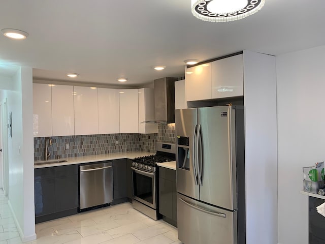 1604 74th St Unit 202, North Bergen, NJ 07047 - kitchen with stainless steel appliances, modern cabinets, wall chimney range hood, light countertops, and recessed lighting