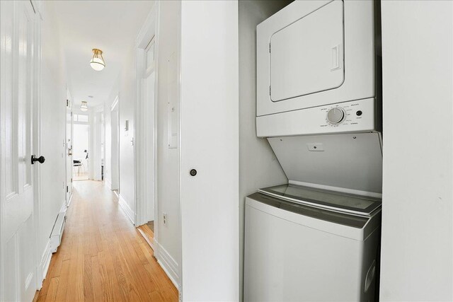 821 Washington St Unit 5, Hoboken, NJ 07030 - laundry area featuring stacked washer / drying machine and light wood finished floors