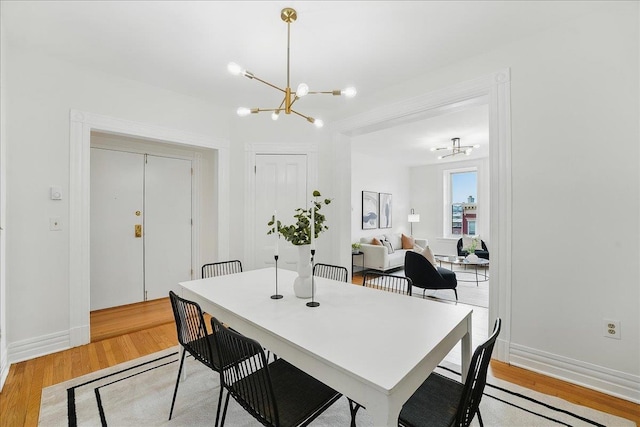 821 Washington St Unit 5, Hoboken, NJ 07030 - dining area with a chandelier and light wood-style flooring