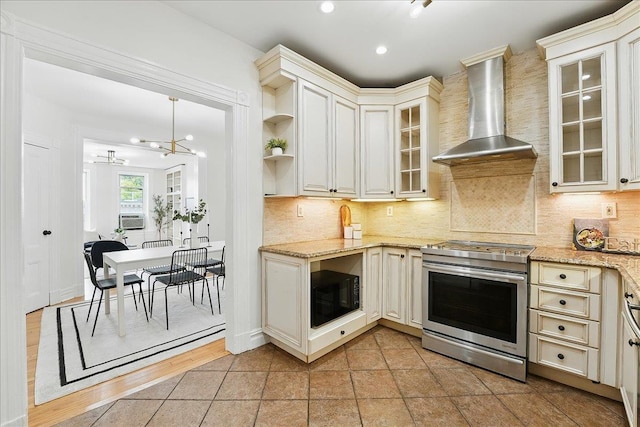821 Washington St Unit 5, Hoboken, NJ 07030 - kitchen featuring stainless steel electric range, wall chimney range hood, black microwave, open shelves, and tasteful backsplash