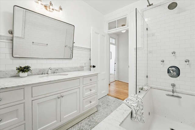 821 Washington St Unit 5, Hoboken, NJ 07030 - full bath featuring vanity, shower / bathtub combination, tile patterned floors, and decorative backsplash