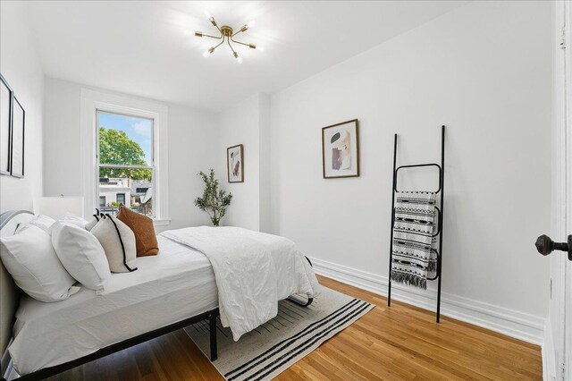821 Washington St Unit 5, Hoboken, NJ 07030 - bedroom with light wood-style floors and baseboards