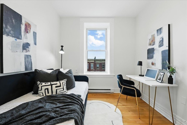 821 Washington St Unit 5, Hoboken, NJ 07030 - bedroom with a baseboard heating unit and wood finished floors