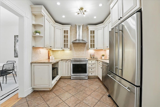 821 Washington St Unit 5, Hoboken, NJ 07030 - kitchen featuring stainless steel appliances, wall chimney range hood, open shelves, tasteful backsplash, and light stone counters