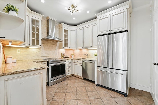 821 Washington St Unit 5, Hoboken, NJ 07030 - kitchen featuring appliances with stainless steel finishes, wall chimney exhaust hood, backsplash, light stone counters, and recessed lighting