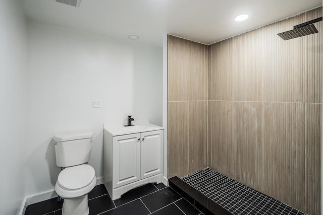 full bathroom featuring a tile shower, tile patterned flooring, toilet, vanity, and recessed lighting