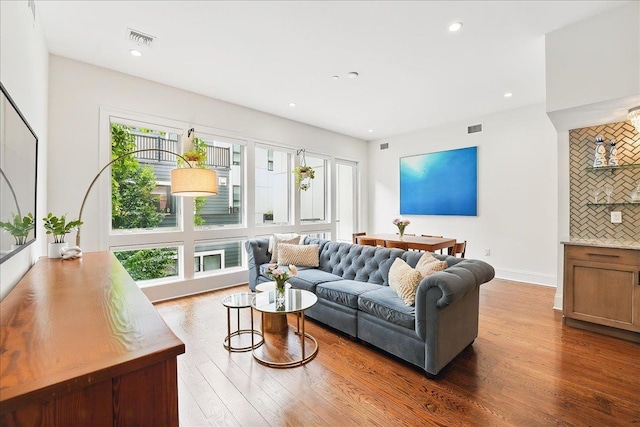 324 Hudson St # 1, Hoboken, NJ 07030 - living room with wood finished floors, recessed lighting, and baseboards