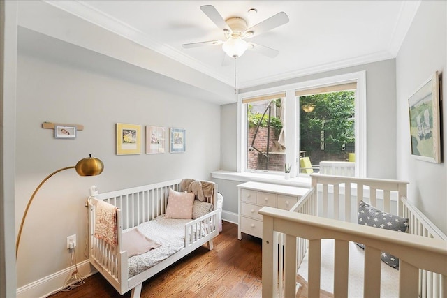324 Hudson St # 1, Hoboken, NJ 07030 - bedroom with ornamental molding, dark wood finished floors, a crib, and baseboards