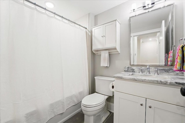 324 Hudson St # 1, Hoboken, NJ 07030 - bathroom with vanity, toilet, shower / bath combo with shower curtain, and baseboards
