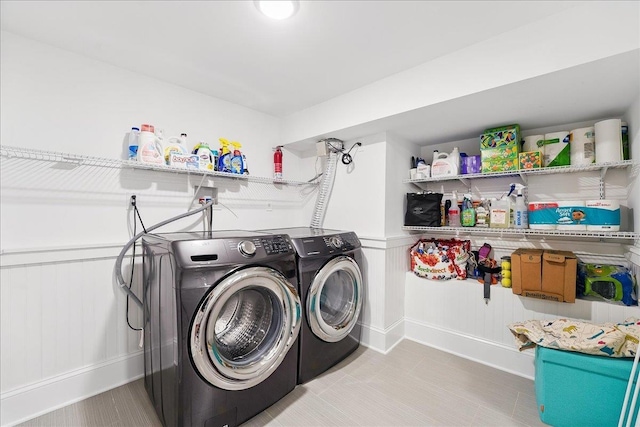 324 Hudson St # 1, Hoboken, NJ 07030 - laundry room with independent washer and dryer, wainscoting, and baseboards