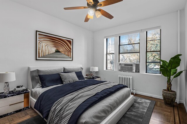 179 Manhattan Ave Unit 3B, Jersey City, NJ 07307 - bedroom featuring radiator heating unit, baseboards, and ceiling fan