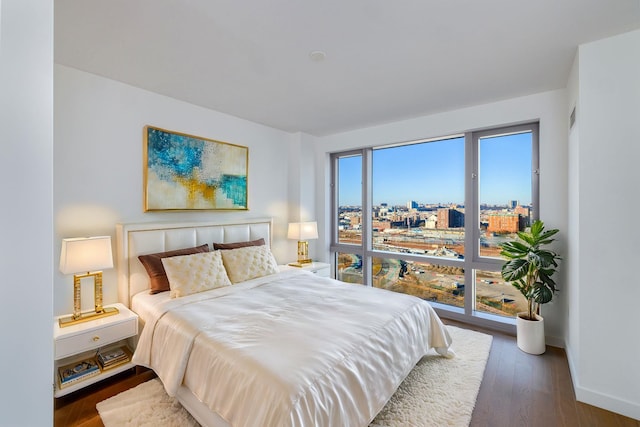 bedroom featuring dark hardwood / wood-style flooring