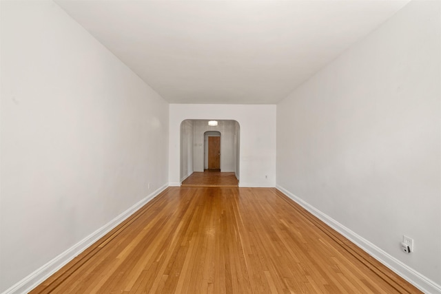 101 Kensington Ave Unit A1, Jersey City, NJ 07304 - unfurnished room featuring arched walkways and light wood-style flooring