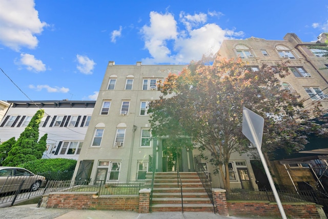 101 Kensington Ave Unit A1, Jersey City, NJ 07304 - view of building exterior featuring a fenced front yard