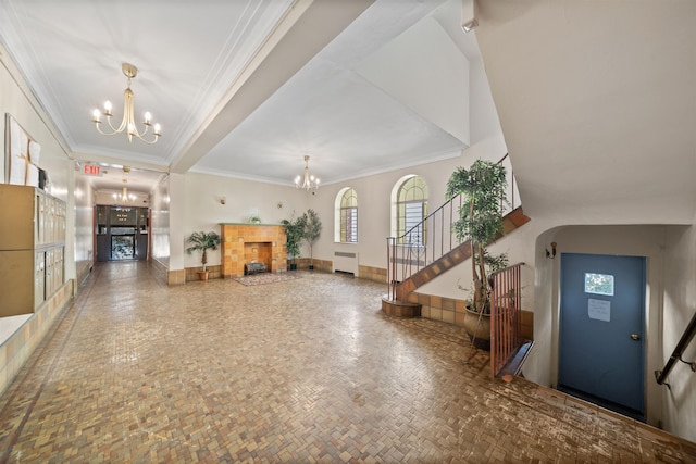 101 Kensington Ave Unit A1, Jersey City, NJ 07304 - foyer featuring a chandelier, stairway, crown molding, a fireplace, and radiator heating unit