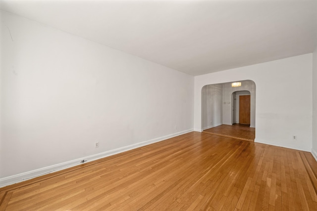 101 Kensington Ave Unit A1, Jersey City, NJ 07304 - spare room featuring arched walkways and light wood-type flooring