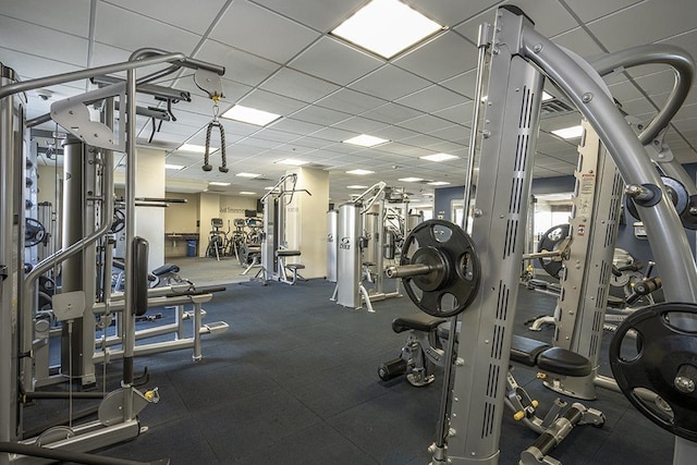 workout area with a drop ceiling