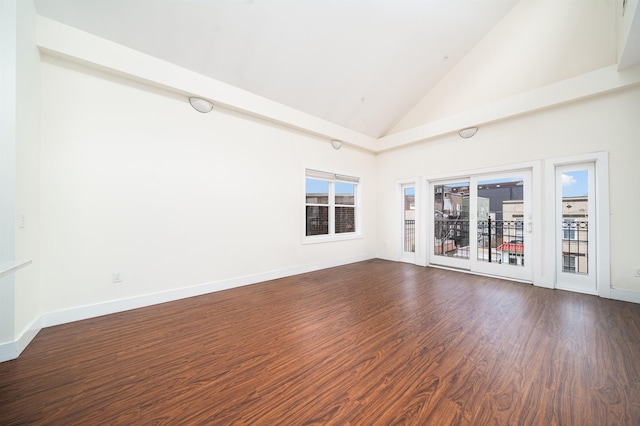 308 18th St, Union City, NJ 07087 - empty room featuring baseboards, dark wood finished floors, and high vaulted ceiling