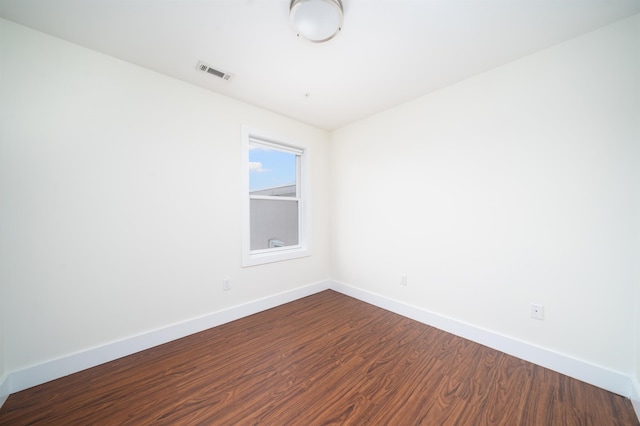 308 18th St, Union City, NJ 07087 - empty room with baseboards, dark wood-style flooring, and visible vents