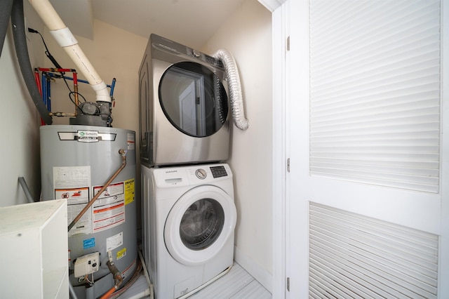 308 18th St, Union City, NJ 07087 - laundry room featuring laundry area, stacked washer and dryer, and gas water heater