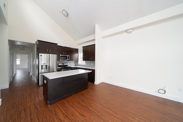 308 18th St, Union City, NJ 07087 - kitchen featuring dark brown cabinetry, a center island, light countertops, high vaulted ceiling, and stainless steel appliances
