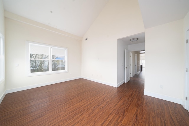 308 18th St, Union City, NJ 07087 - unfurnished room with high vaulted ceiling, baseboards, dark wood-type flooring, and a wealth of natural light