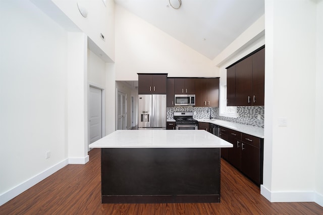 308 18th St, Union City, NJ 07087 - kitchen with baseboards, dark wood-style floors, light countertops, tasteful backsplash, and stainless steel appliances